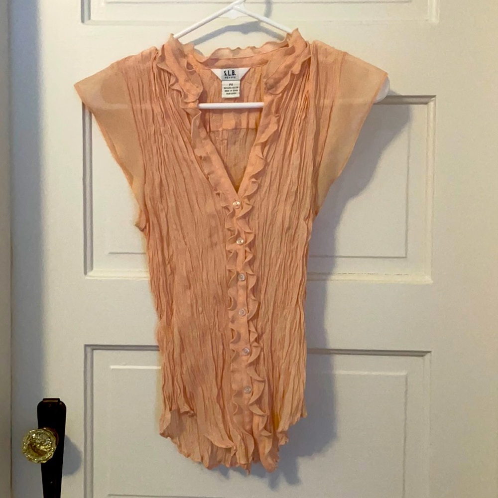 Cute pink ruffled blouse with cap sleeves